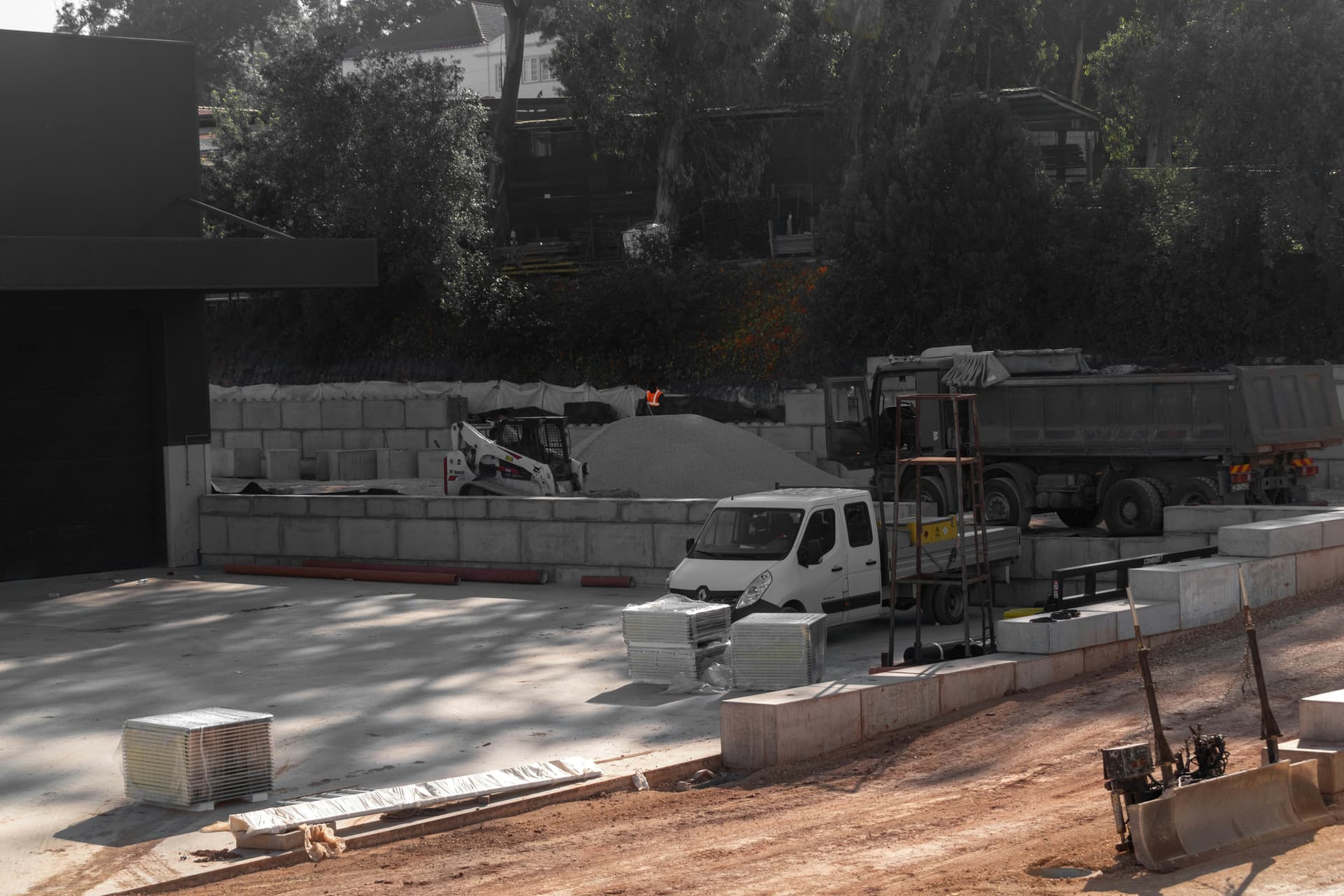 Stacked concrete block retaining walls holding a grade change